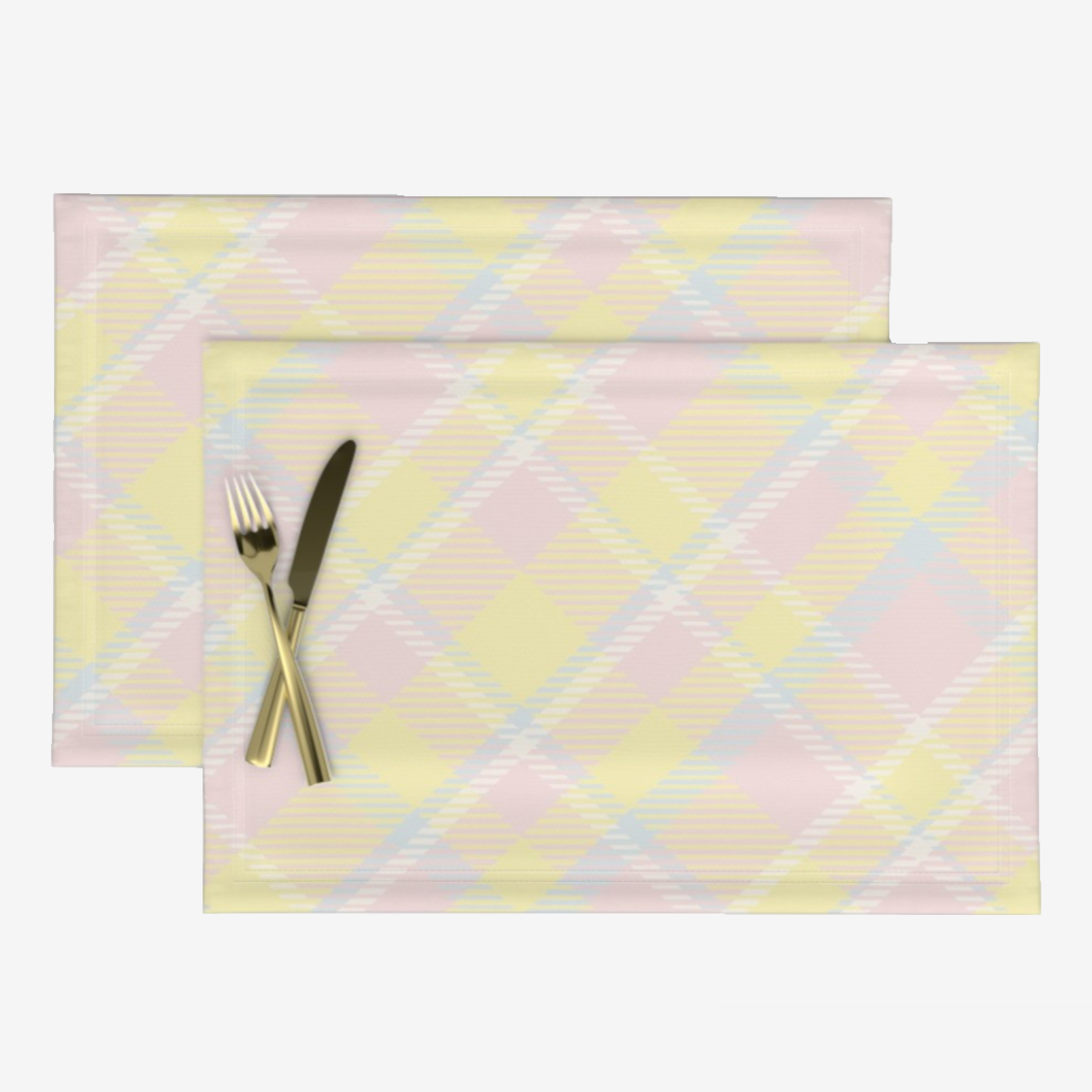 image shows a knife and fork on a pair of fabric placemats.  The placemats feature a diagonal plaid pattern  in soft pastel shades of buttermilk, cream, light blue and baby pink.