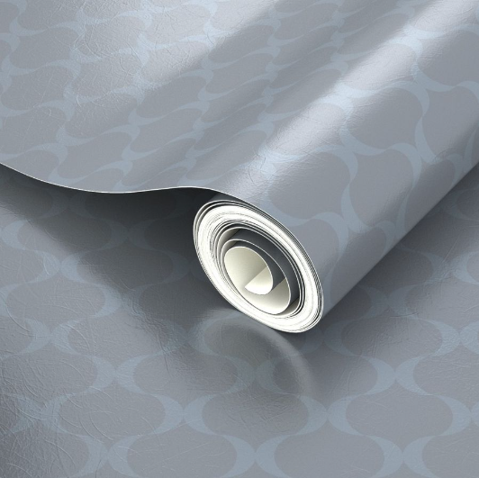 Partial roll of wallpaper with a subtle blue ribbon-like pattern with a silver sheen.